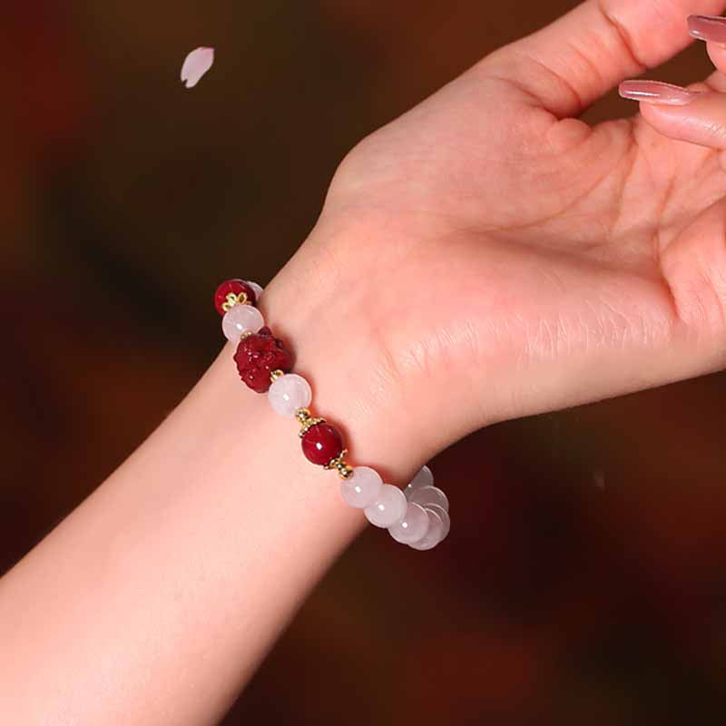 Armband Zinnober Kristall Fuchs Liebe elastisch Naturstein Handgelenk getragen