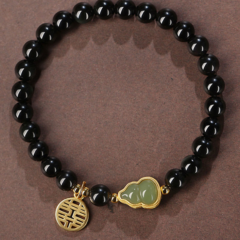 Armband Schwarzer Obsidian Jade – Stärke & Glück, goldene Anhänger elastisch.