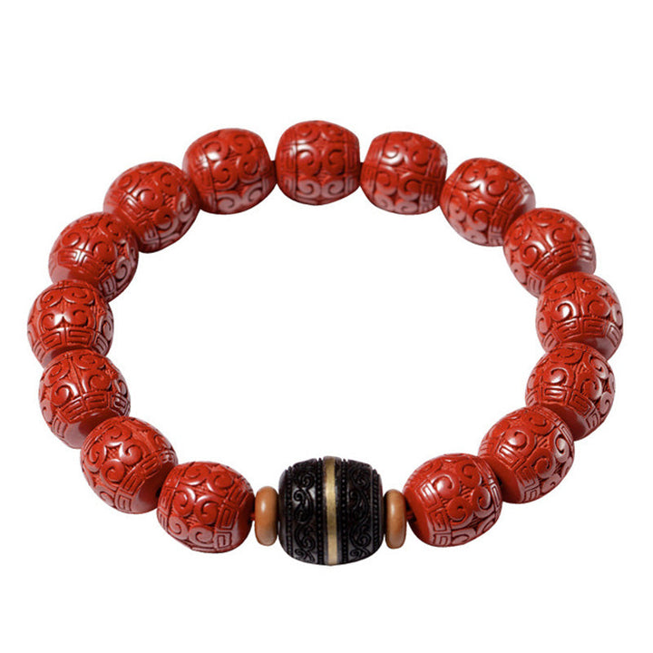 Armband Zinnober Ebenholz mit geschnitzten roten Perlen elastisch.
