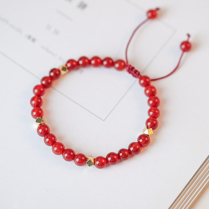 Rotes Achat Armband mit goldenen Perlen elastisch Makramee Verschluss