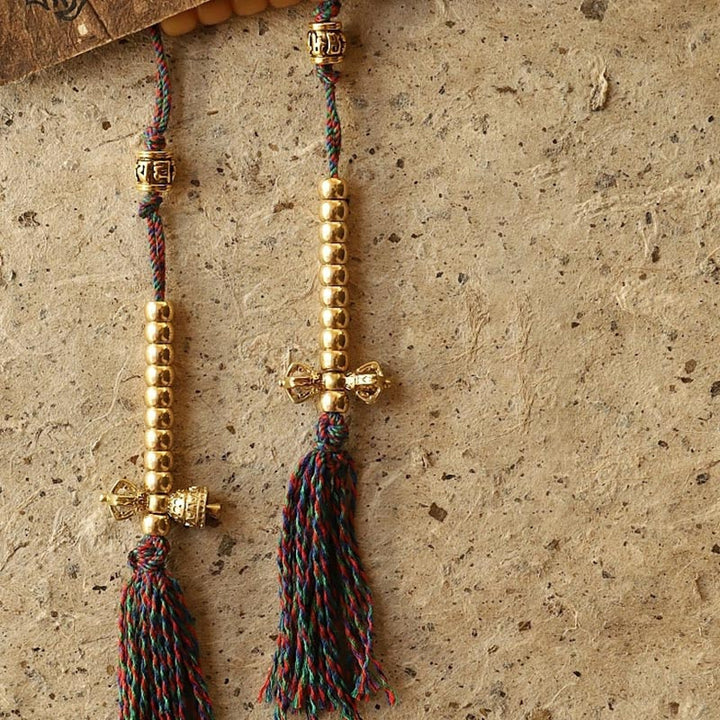 Mala Bodhi Wohlstand Energie goldene Perlen mehrfarbiges Seidenband Quaste.