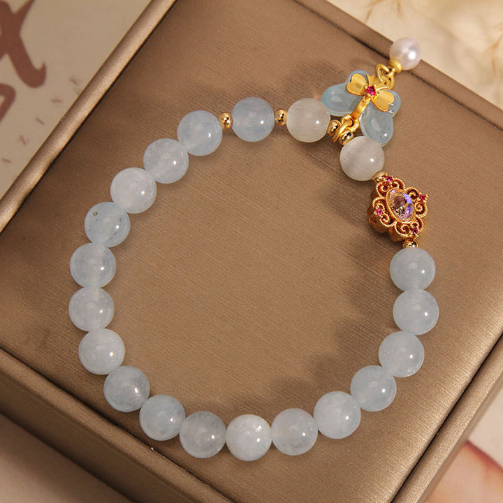 Armband Aquamarin Perle Schmetterling Heilung Energie elegant golden verziert