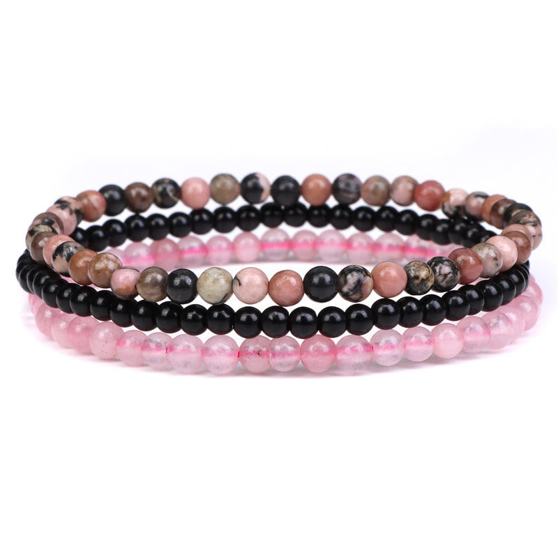 Armband Kristall – Frieden rosa schwarze Perlen elastisch gestapelt