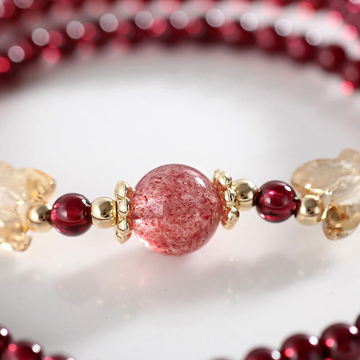 Armband Erdbeerquarz Granat Schmetterling elegant rosé Naturstein Perlen golden