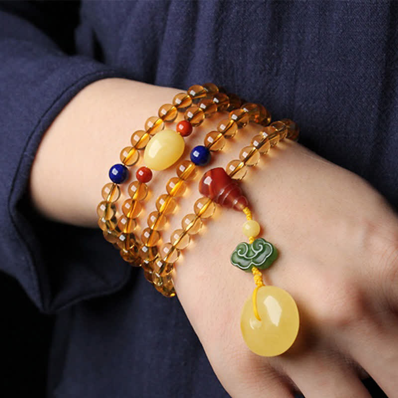 Armband Roter Achat Citrin Pixiu am Handgelenk getragen elastisch Naturstein