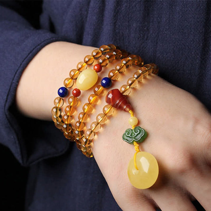 Armband Roter Achat Citrin Pixiu am Handgelenk getragen elastisch Naturstein