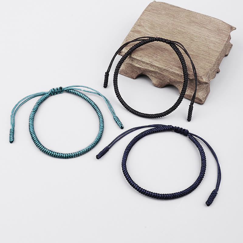 Drei geflochtene Armbänder Knoten Tibet in Türkis Schwarz Dunkelblau