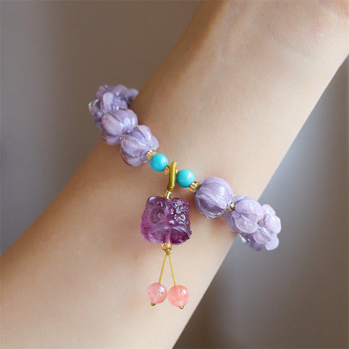 Armband Fluorit Lotus mit lila Perlen und türkisen Steinen elegante Handarbeit