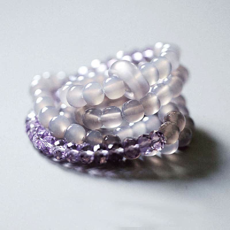 Armband Amethyst Kristall Heilung Stärke lila weiß Perlen elastisch
