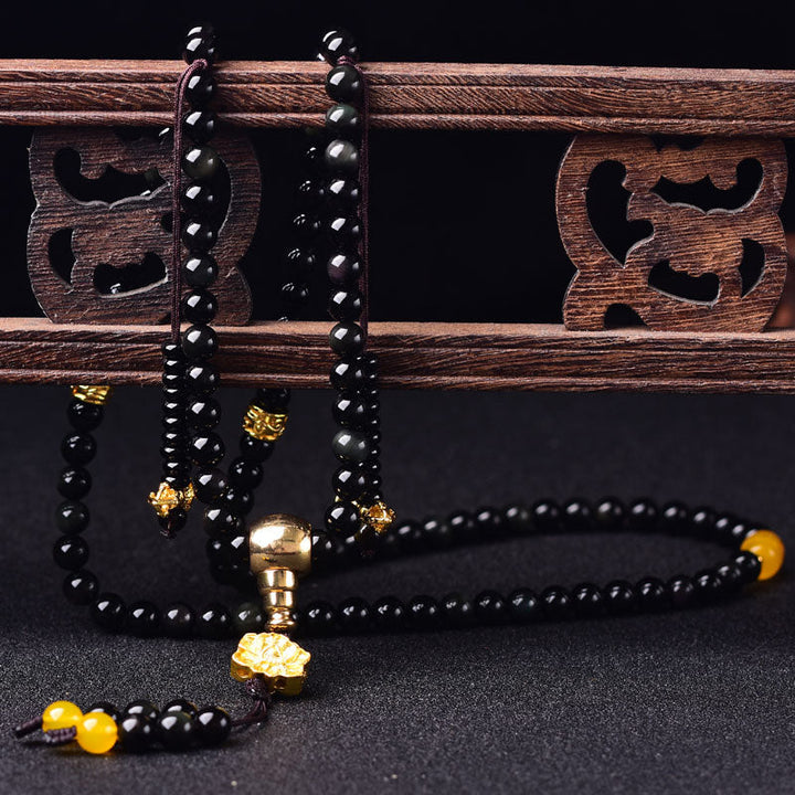 Armband Schwarzer Obsidian Lotus mit goldenen Perlen Holzschmuck
