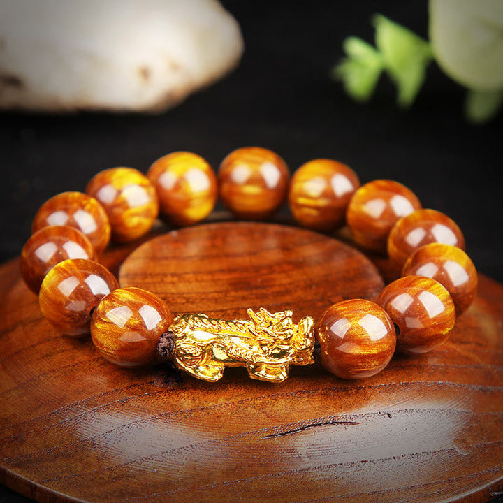Armband Tigerauge Pixiu – Glück goldener Pixiu Naturstein Flachaufnahme