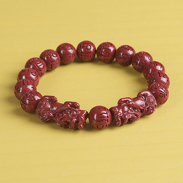 Zinnober Armband mit Om Mani Padme Hum Gravur Glück Wohlstand elastisch