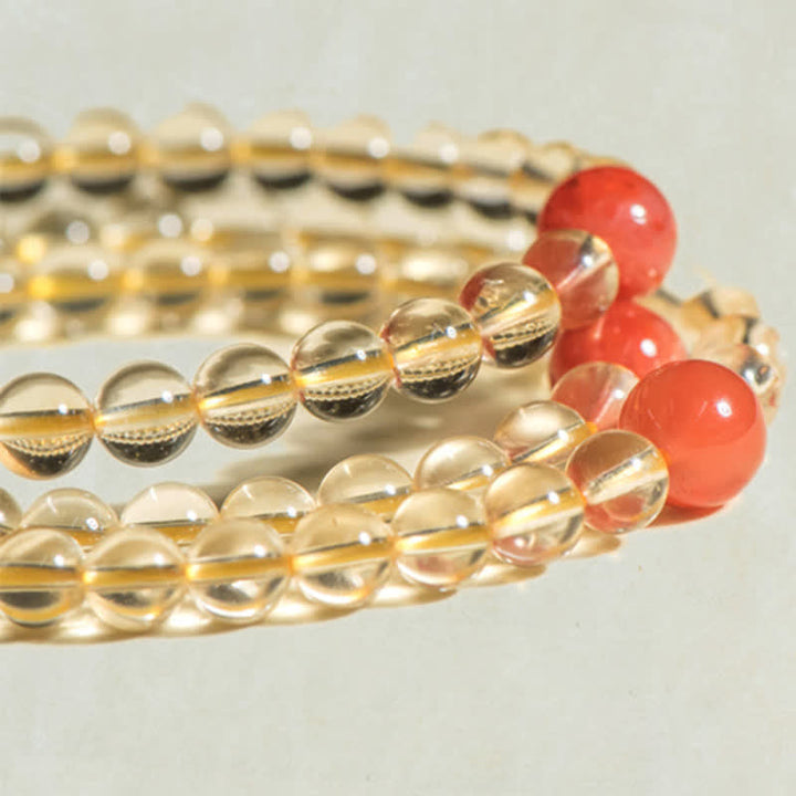 Mala Armband mit Citrin Perlen und roten Achat Kugeln elegantes Design.