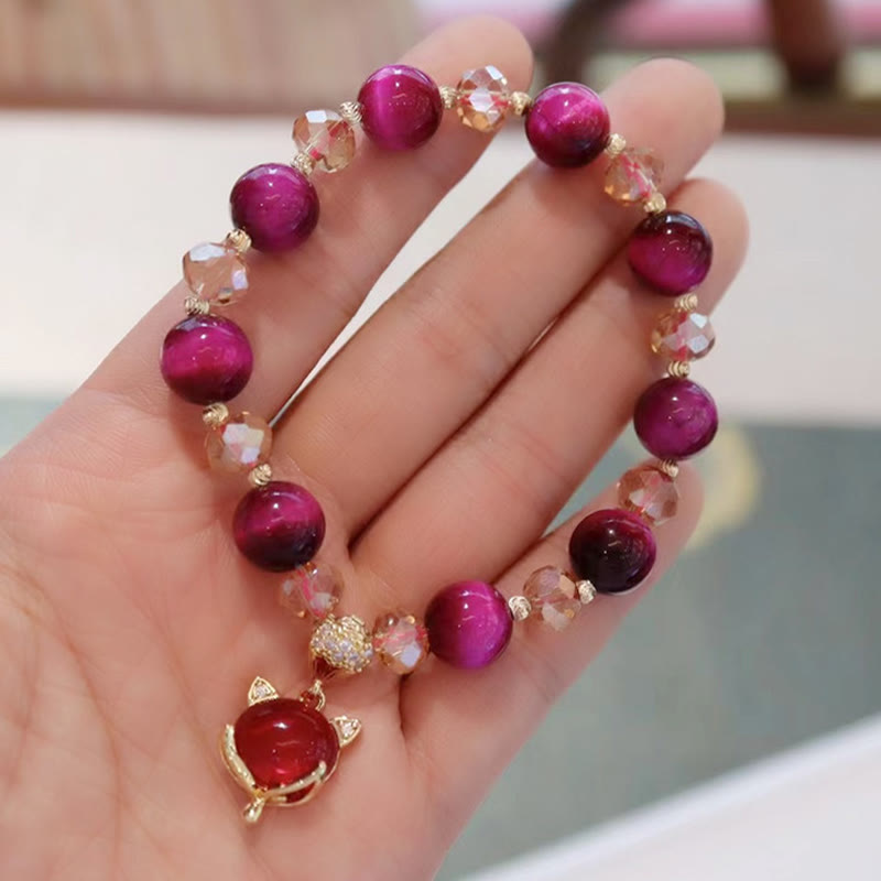 Armband Tigerauge Pixiu mit roten Steinen und goldenen Perlen elastisch