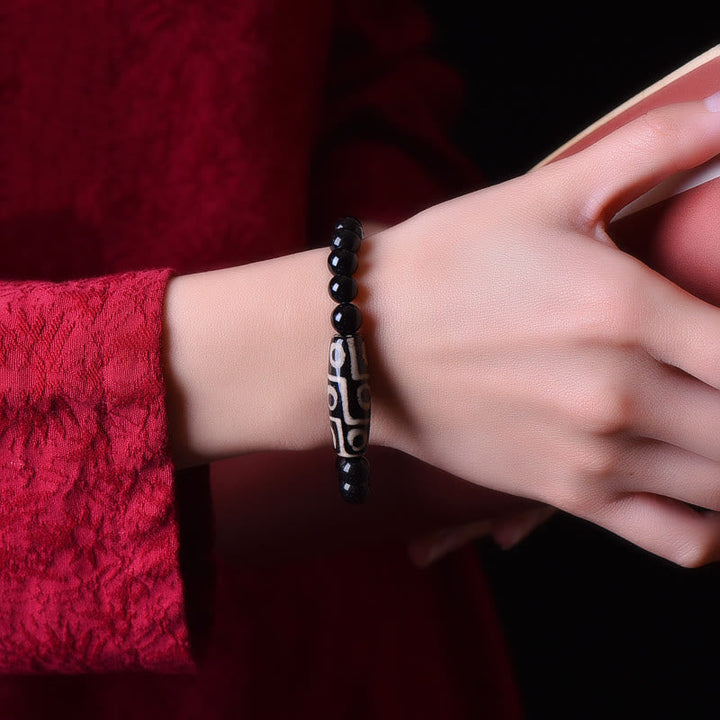 Armband – Wohlstand Energie schwarze Perlen Naturstein elastisch Handgelenk getragen