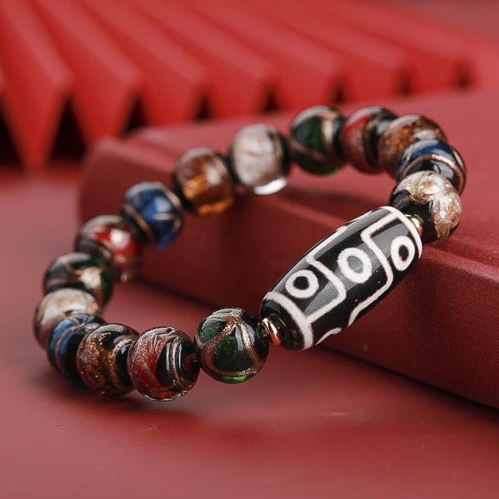 Armband – Wohlstand Balance mit Natursteinen und tibetischen Perlen elegant.