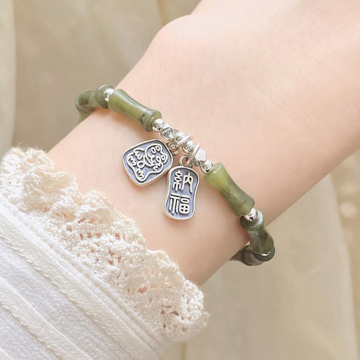 Jade Armband 925 Silber Fu-Zeichen Glück Fülle Naturstein elastisch getragen