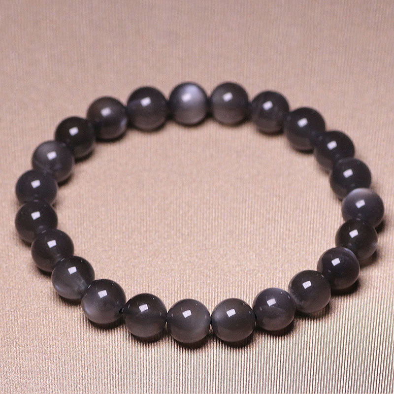 Mondstein Armband in Grau mit glänzenden Perlen elastisch geschlossen