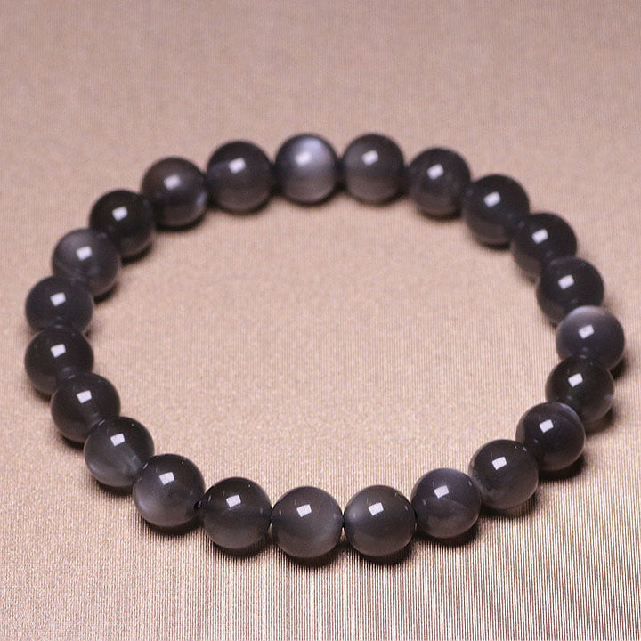 Mondstein Armband in Grau mit glänzenden Perlen elastisch geschlossen
