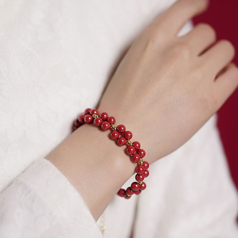 Armband Zinnober – Segen Harmonie rote Perlen elastisch Handgelenk getragen