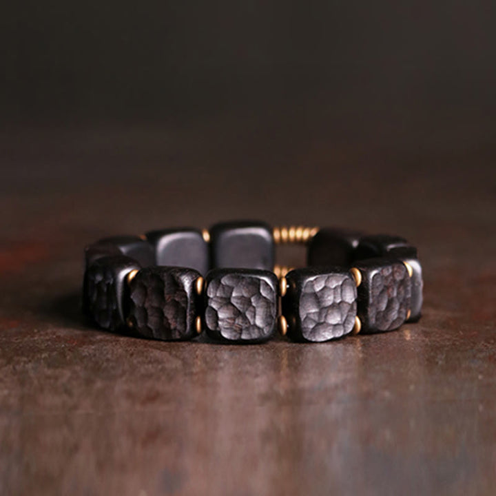 Armband Kupfer Ebenholz mit strukturierten Perlen elegantes Design schwarz