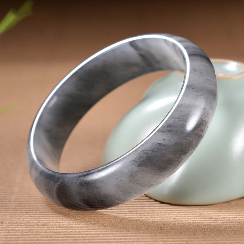 Jade Armband Armreif grauer Stein glatte Oberfläche Wohlstand Segen