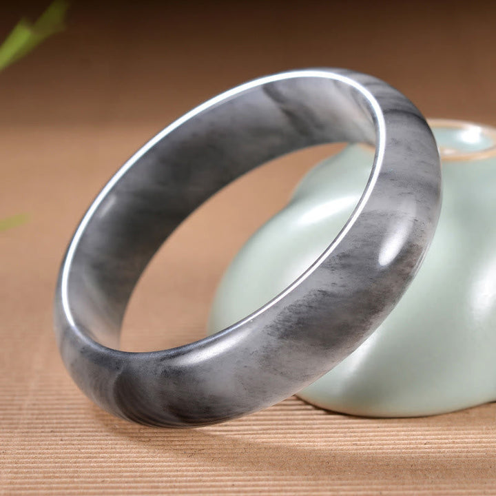 Jade Armband Armreif grauer Stein glatte Oberfläche Wohlstand Segen