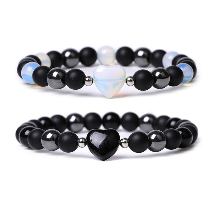 Armband Schwarzer Onyx Tigerauge mit Herz Anhänger elegant gestaltet.