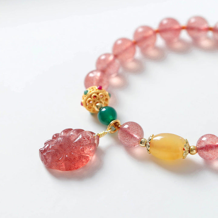 Armband Erdbeerquarz Fuchs Heilung rosa Perlen Gold elegant Schmuck