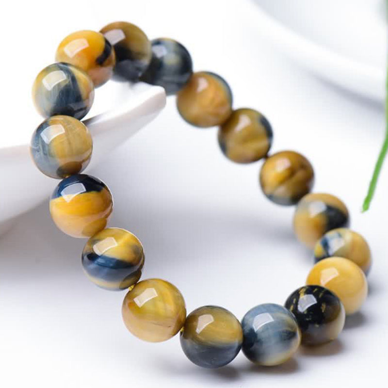 Armband Tigerauge – Schutz & Stärke, goldbraune facettierte Perlen elastisch.
