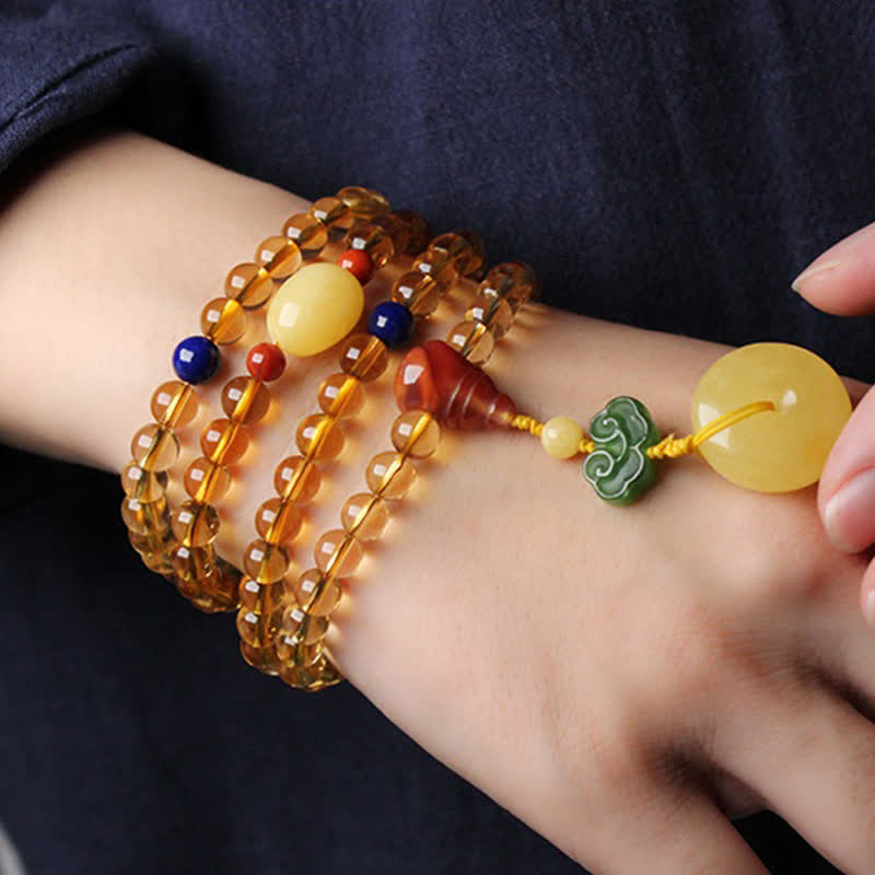 Armband Roter Achat Citrin Pixiu am Handgelenk getragen Naturstein elastisch
