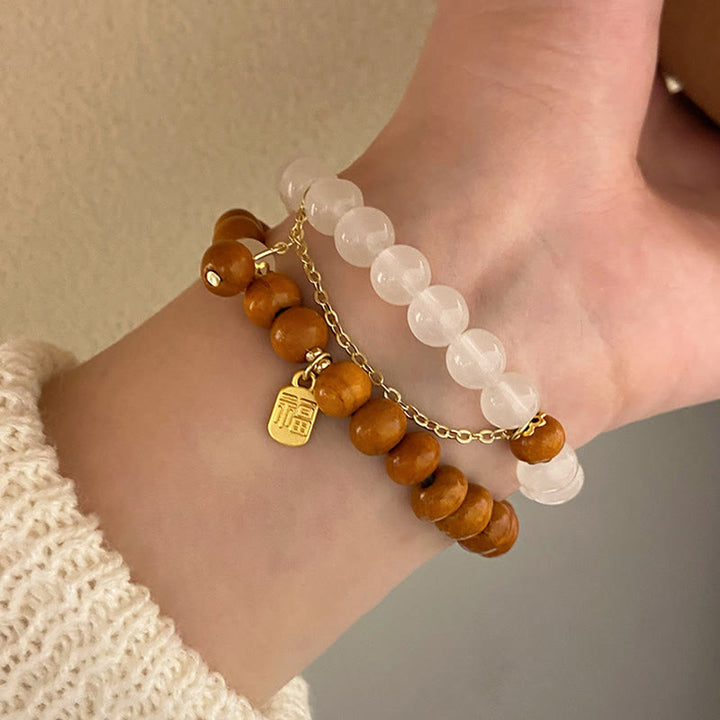 Armband Sandelholz Fu-Zeichen Schutz elastisch Naturstein Perlen getragen