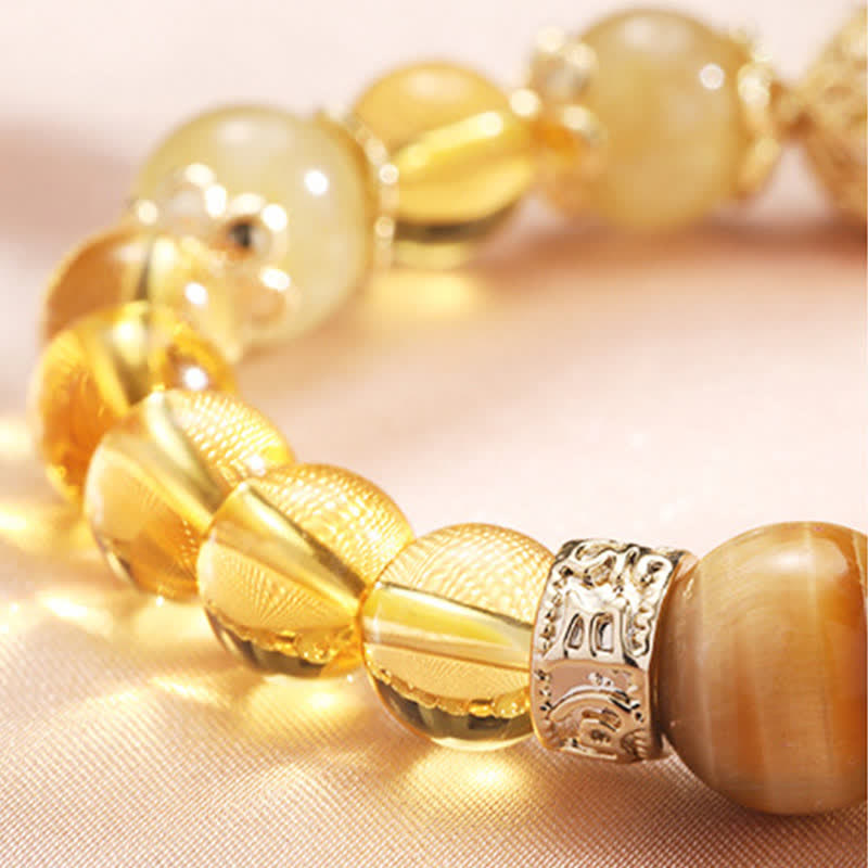 Armband Citrin – Wohlstand mit facettierten goldenen Steinen und Metallakzenten.