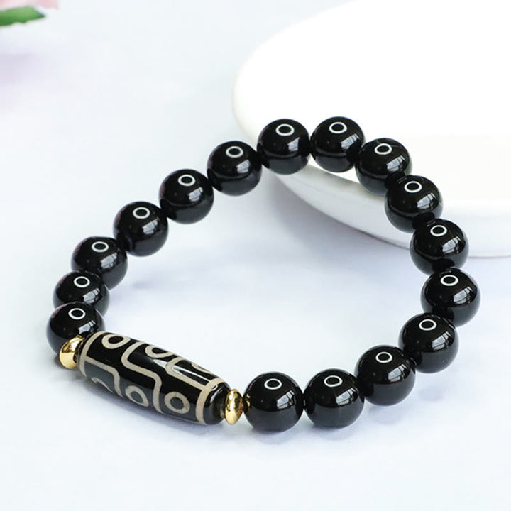 Armband Schwarzer Onyx mit Perlen und verzierter Röhrenfassung elastisch.