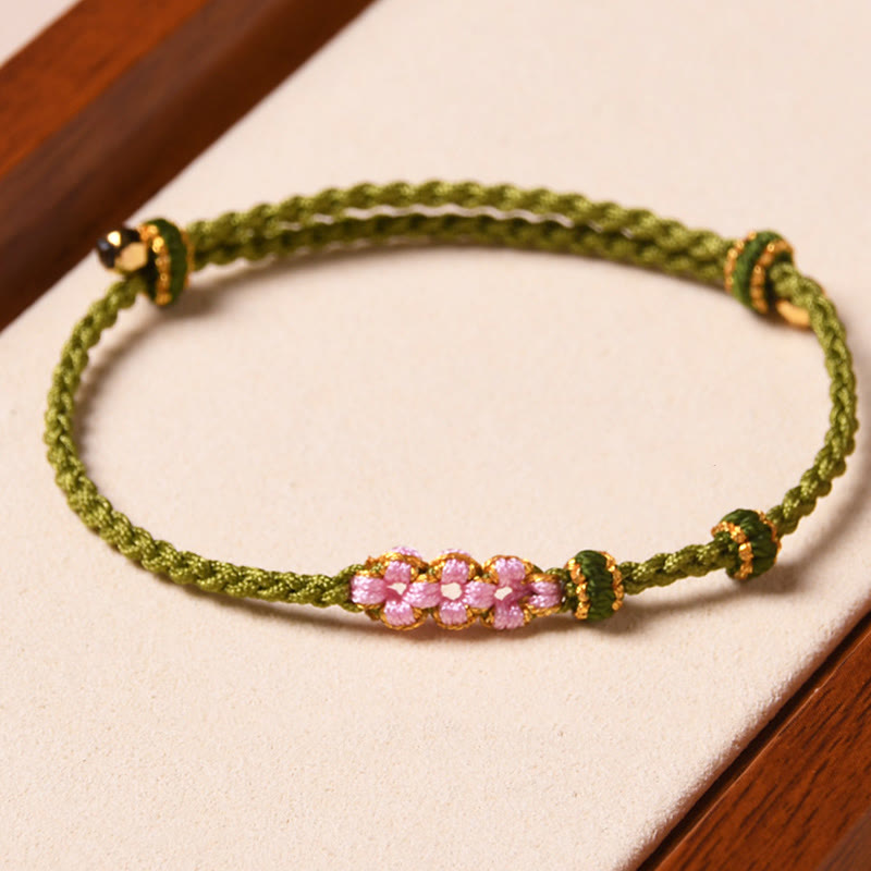 Armband Pfirsichblüte – Schutz grünes Seil rosa Perlen elastisch Handgelenk