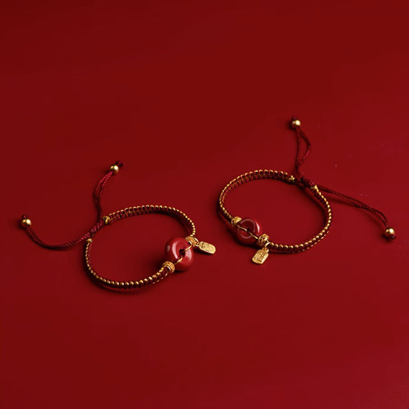Armband Zinnober Fu-Zeichen Frieden Segen goldene Perlen rotes Band elastisch