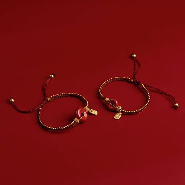 Armband Zinnober Fu-Zeichen Frieden Segen goldene Perlen rotes Band elastisch