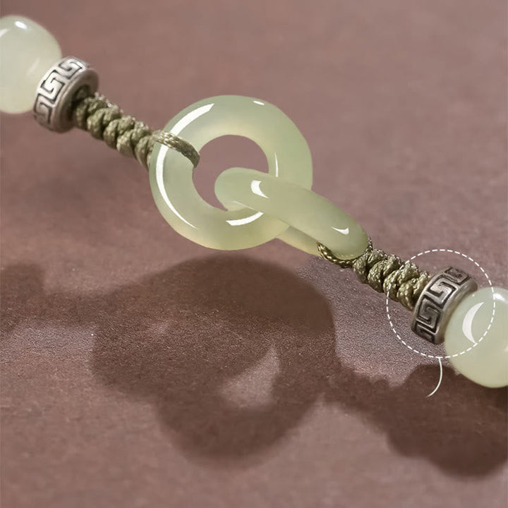 Jade Armband mit grünem Stein, Glück und Balance Symbol