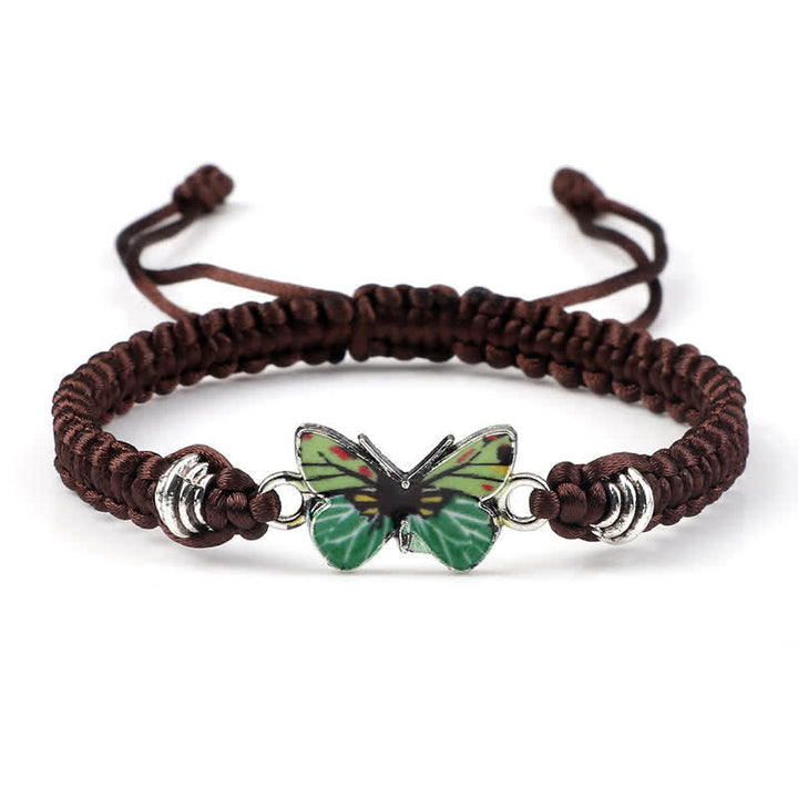 Armband Schmetterling – Liebe grüner Schmetterling braunes Seilarmband Flachaufnahme