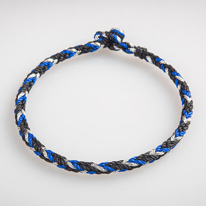 Armband Mehrfarbig Glücksband blau schwarz weiß geflochten Glücksband Flachansicht
