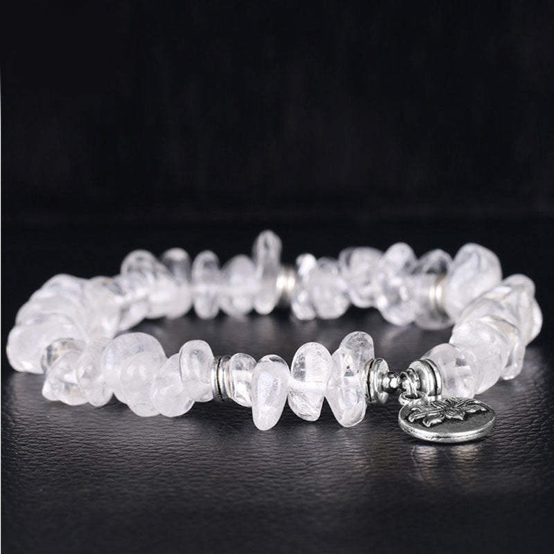 Armband Weißer Kristall Lotus Heilung mit silbernem Charm elegant.