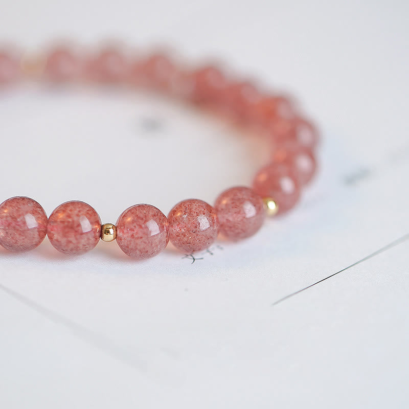 Erdbeerquarz Armband mit goldenen Perlen elegante Perlenreihe