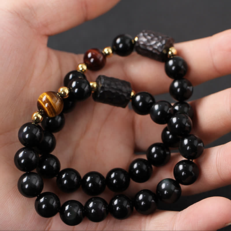 Armband Schwarzer Obsidian Tigerauge Paar elastisch getragen Handgelenk