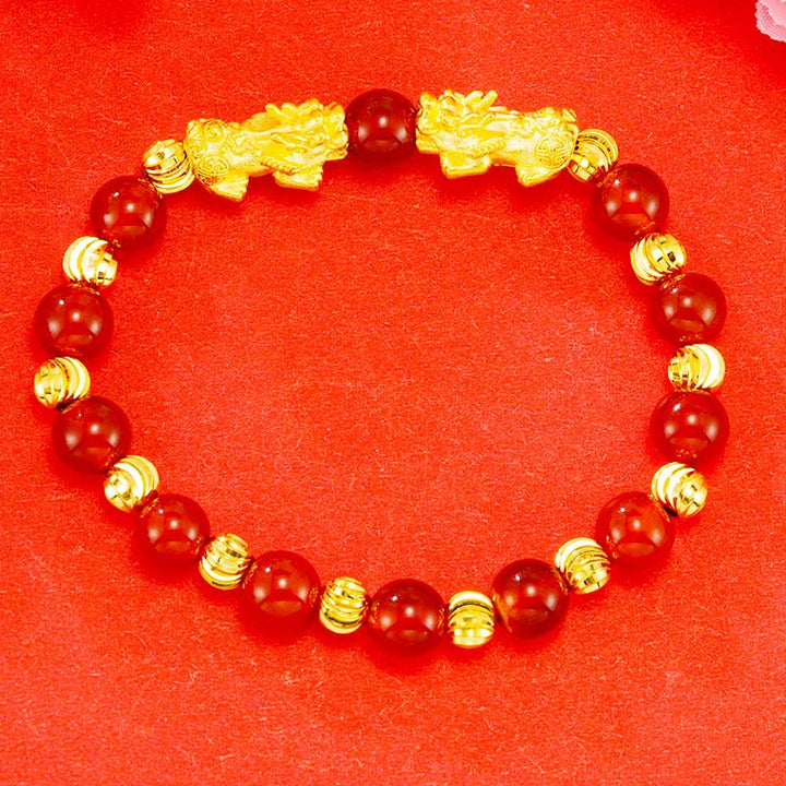 Armband Pixiu – Wohlstand rote Perlen goldene Zwischenelement elegantes Design