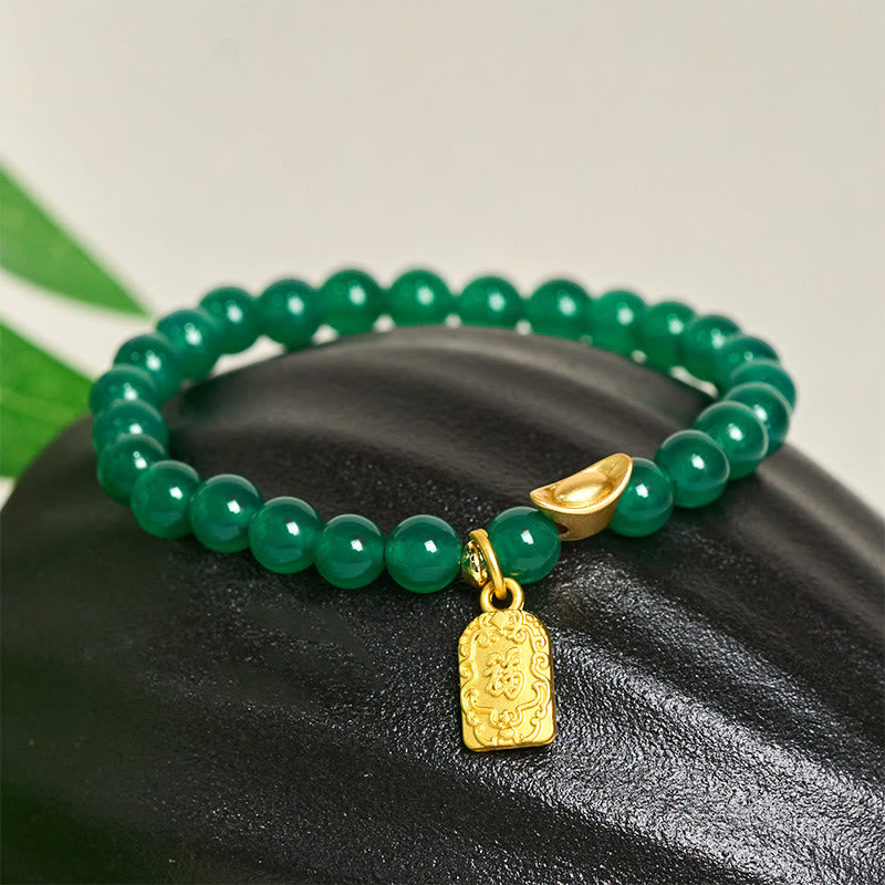 Armband Achat Fu-Zeichen grüne Perlen goldener Anhänger Glück Wohlstand Schutz