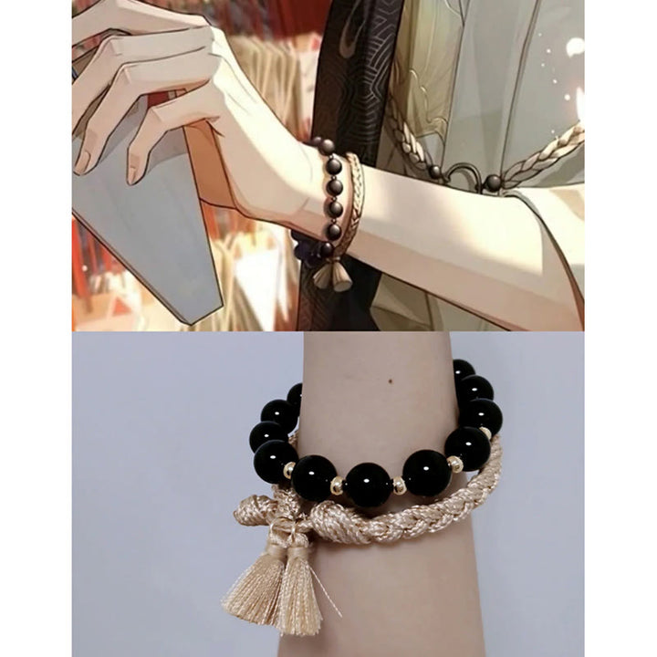 Armband Schwarzer Onyx – Schutz mit Quaste am Handgelenk getragen.