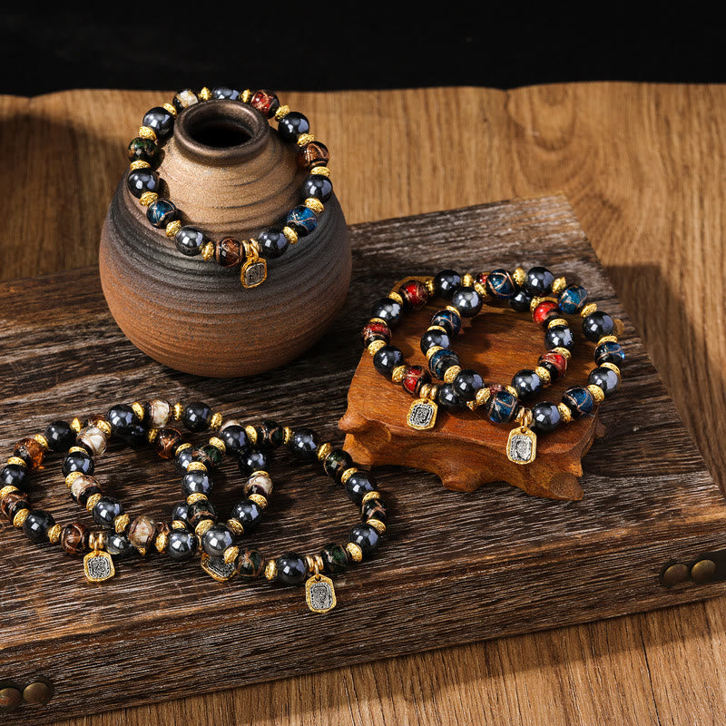 Schwarze Obsidian Perlen Armband mit goldenen Akzenten Glück Wohlstand