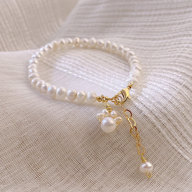 Armband Perle Katze – Heilung weiße Perlen goldene Verschlüsse elegant