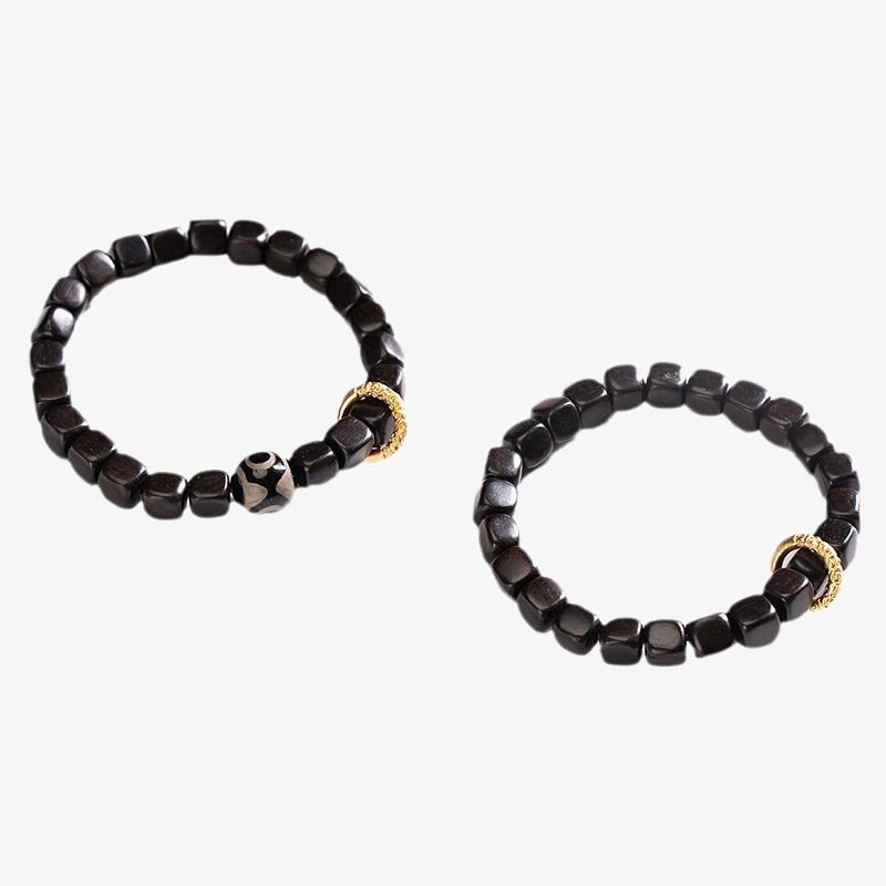 Armband Ebenholz mit goldenen Perlen Balance und Ruhe Naturstein