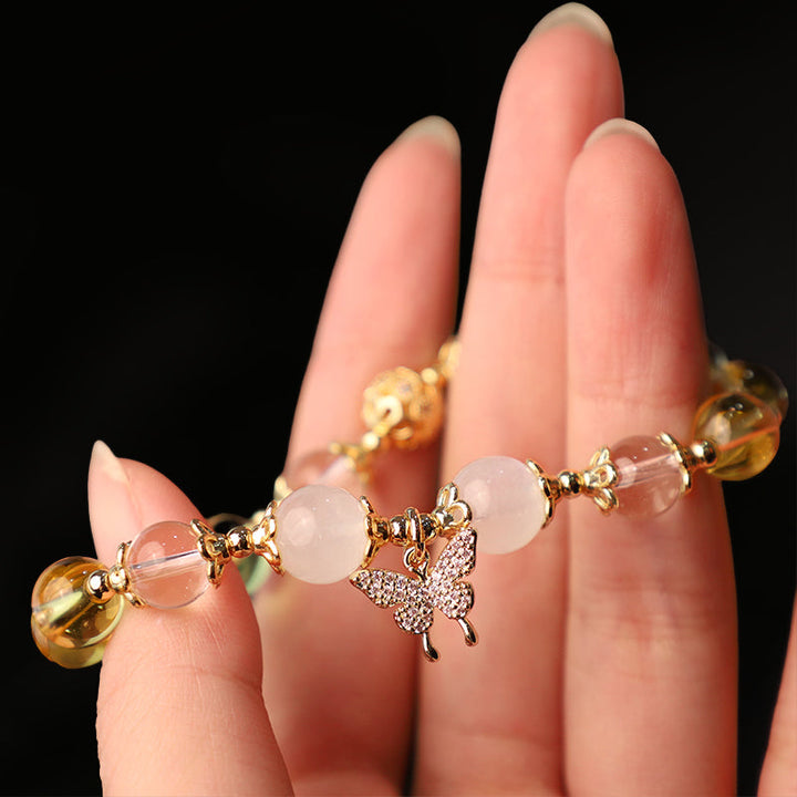 Armband Mondstein Citrin Schmetterling Schutz Wohlstand an Hand getragen Gold